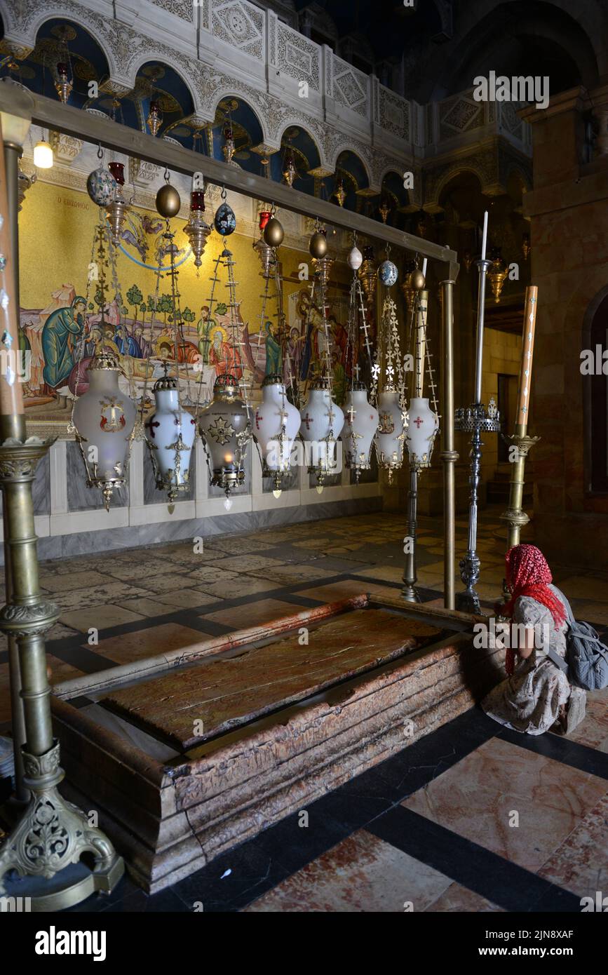 The Stone of Anointing inside the church of the holy Sepulchre in the old city of Jerusalem. Stock Photo
