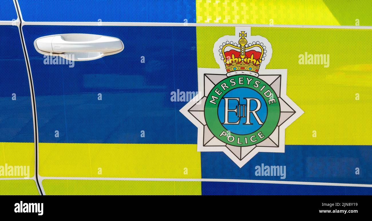 Logo and name on Merseyside Police car Liverpool Stock Photo