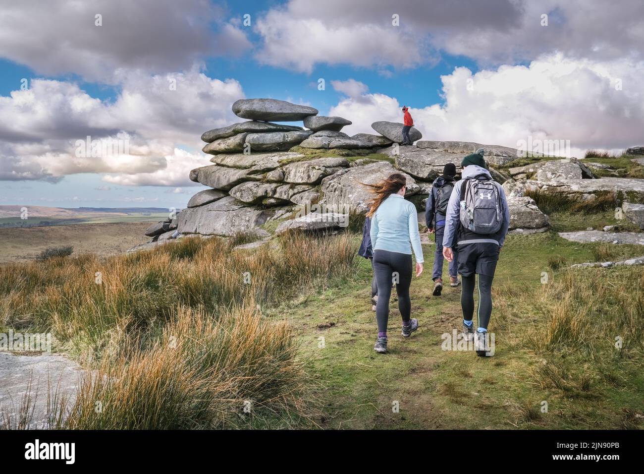 A group of walkers on the summit of Stowes Hill on Bodmin Moor in Cornwall. Stock Photo