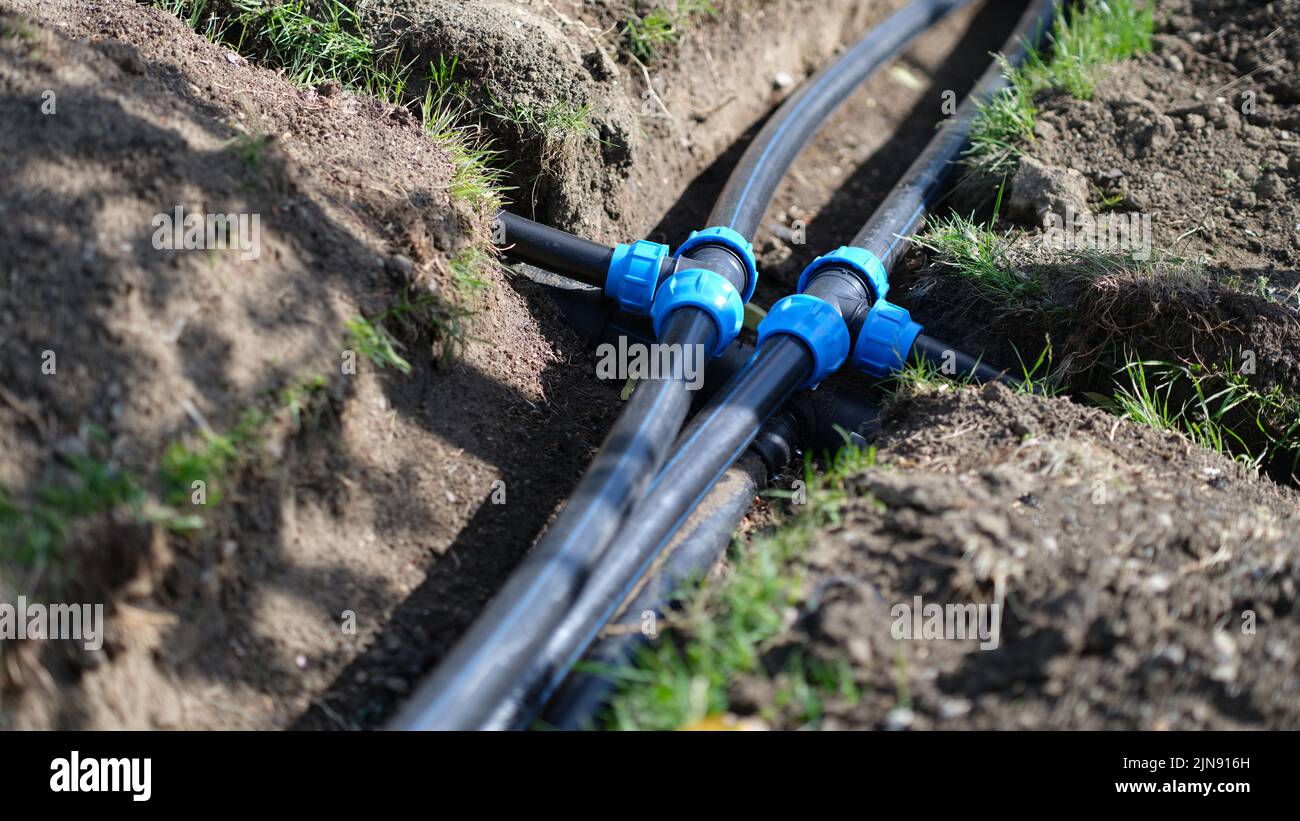 Installed PVC water pipes in trench at summer cottage Stock Photo Alamy
