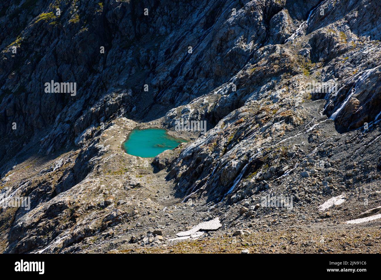 turquoise colored glacial pond near Steingletscher in the Bernese Alps Stock Photo
