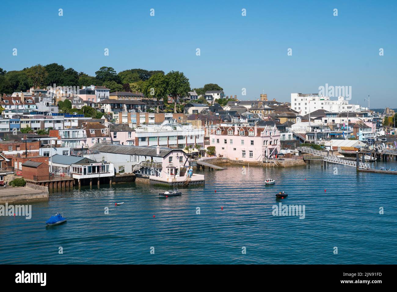 General view of homes overlooking the marine in West Cowes on the Isle of Wight on a sunny summer day. Stock Photo
