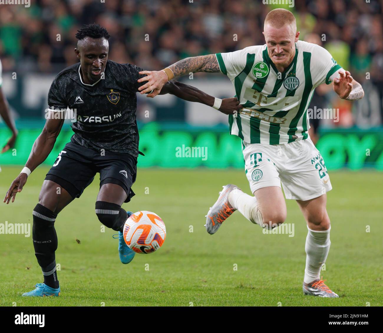 BUDAPEST, HUNGARY - AUGUST 9: Gara Garayev of Qarabag FK fouls Aissa  Laidouni of Ferencvarosi TC during the UEFA Champions League Qualifying  Round match between Ferencvarosi TC and Qarabag FK at Ferencvaros