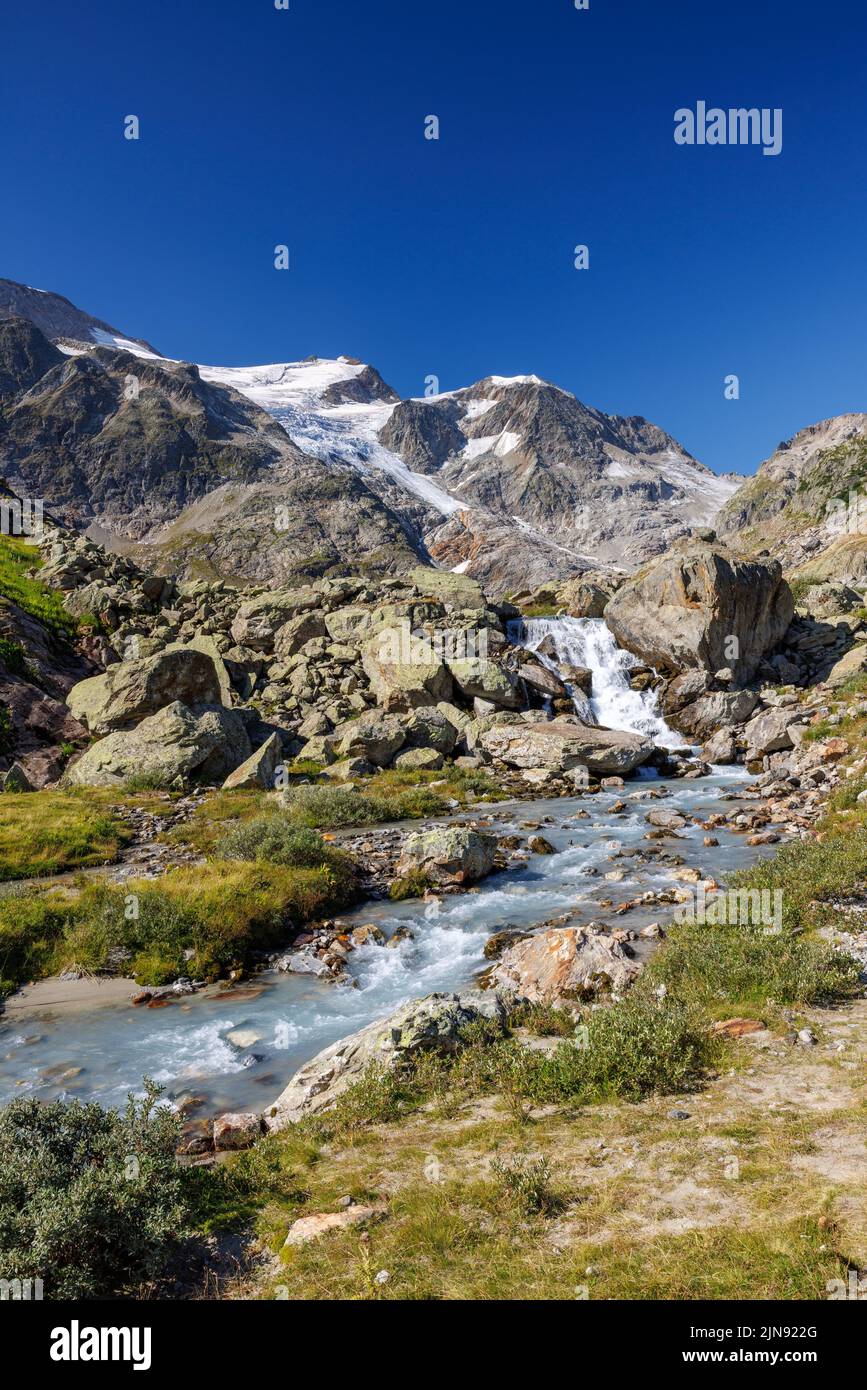 mountain creek in front of Steingletscher on Sustenpass in the Bernese Alps Stock Photo