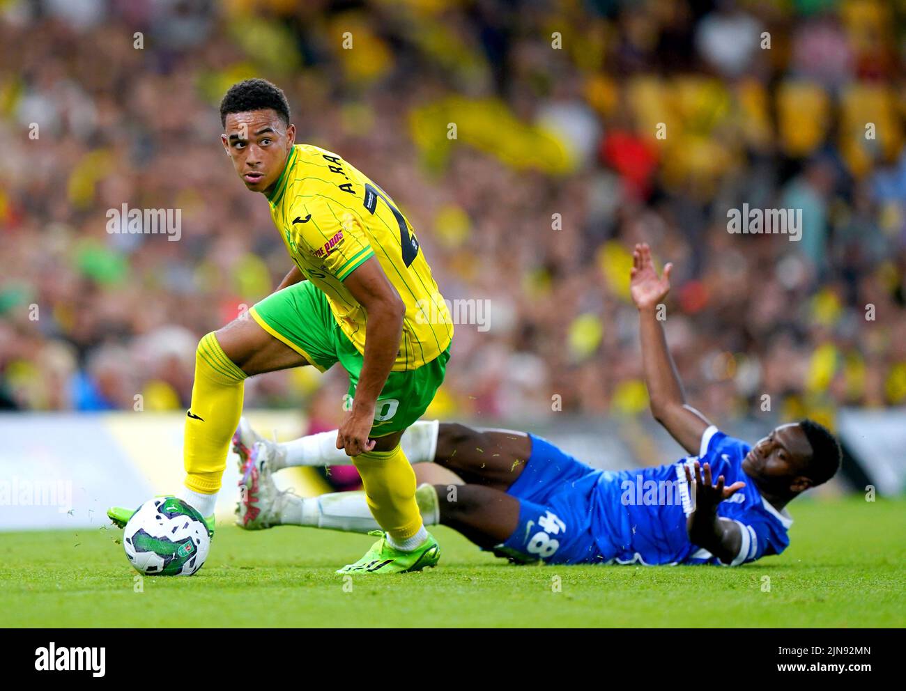 Norwich City's Aaron Ramsey (left) gets the ball away from Birmingham City's Josh Williams during the Carabao Cup, first round match at Carrow Road, Norwich. Picture date: Tuesday August 9, 2022. Stock Photo