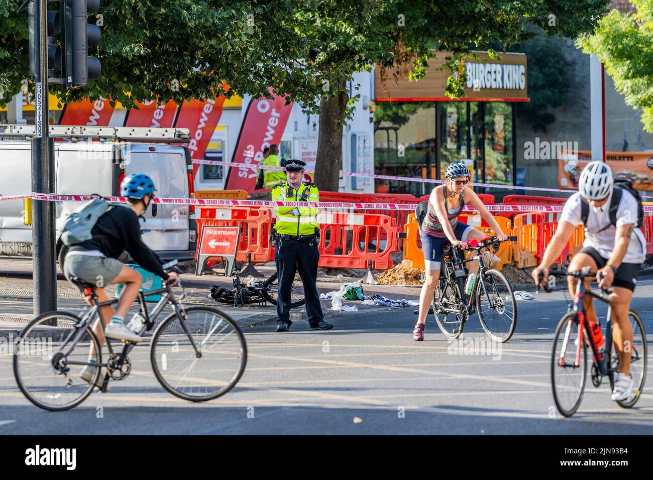 London, UK. 10th Aug, 2022. Police block Balham Hill after a deliveroo rider hits a van outside the Shell petrol station. According to a witness the rider was not wearing a helmet and suffered a head injury. Credit: Guy Bell/Alamy Live News Stock Photo
