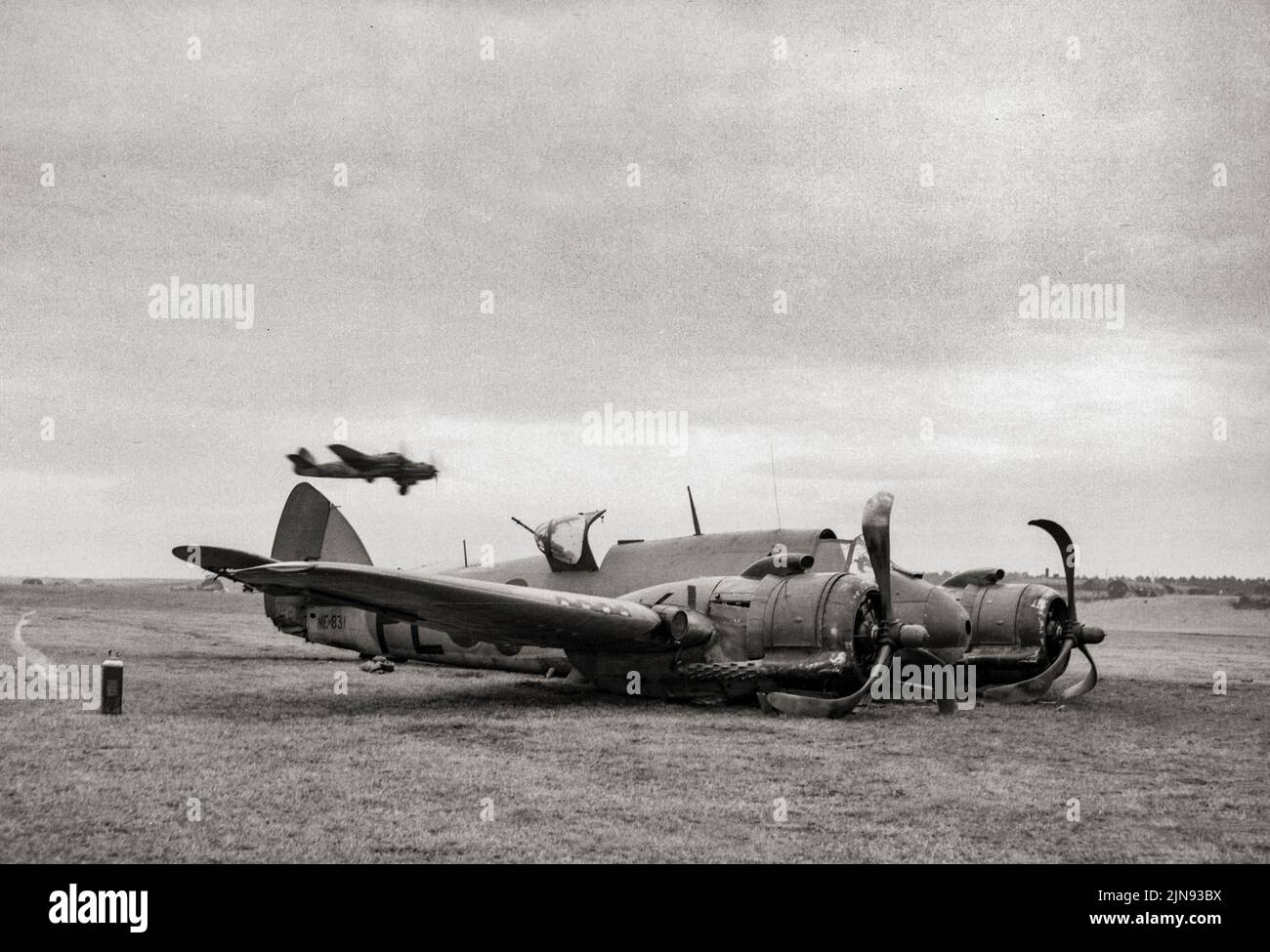 A damaged Bristol Beaufighter TF Mark X of No. 144 Squadron RAF, at rest after crash-landing at Dallachy, Morayshire, on returning from an attack on a German destroyer Z-33 and its escorting vessels in Fordefjord, Norway, in 1945. The Bristol Beaufort was a British twin-engined torpedo bomber. They first saw service with Royal Air Force Coastal Command and then the Royal Navy Fleet Air Arm from 1940 being used as torpedo bombers, conventional bombers and mine-layers until 1942, when they were removed from active service. Stock Photo