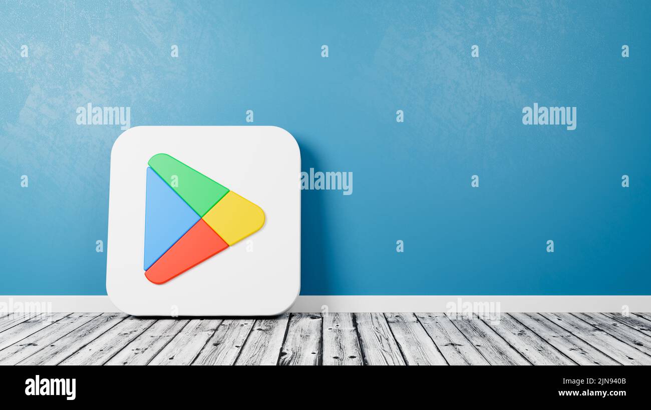 Google Play Store App 2022 Icon on Wooden Floor Against Wall Stock Photo