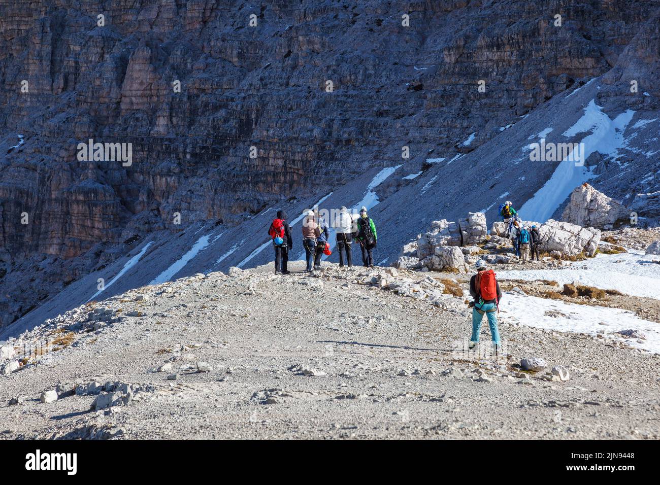 Hikers in the Dolomites mountains Stock Photo