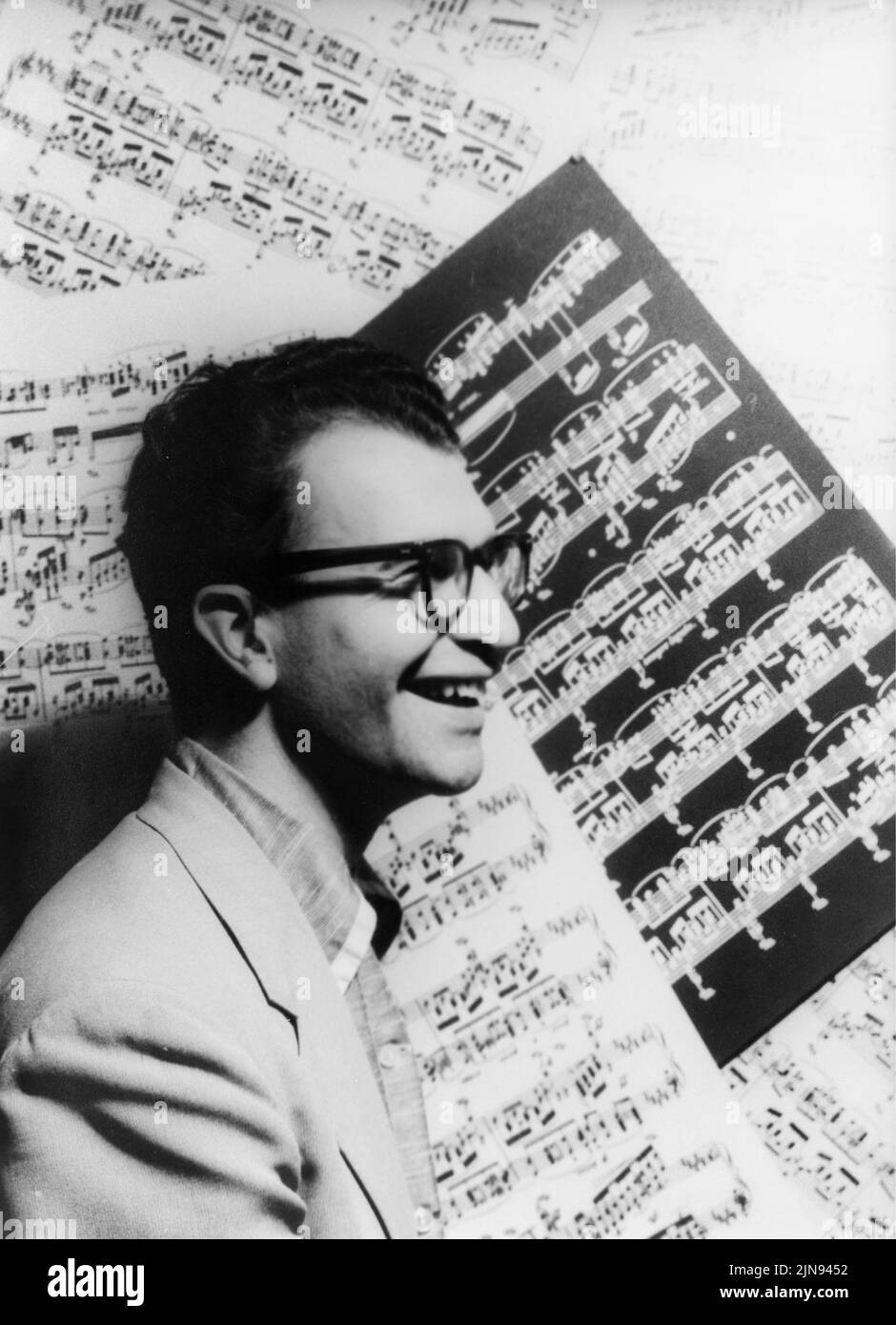 USA -- 08 October 1954 -- Studio portrait of Dave Brubeck ( 1920-2012 ) with sheet music as backdrop -- Picture by Carl Van Vechten/Geopix Stock Photo