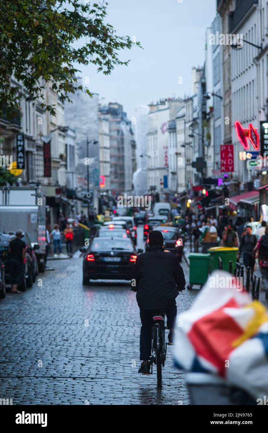 A vertical shot of a street in Paris on a rainy day. France Stock Photo ...