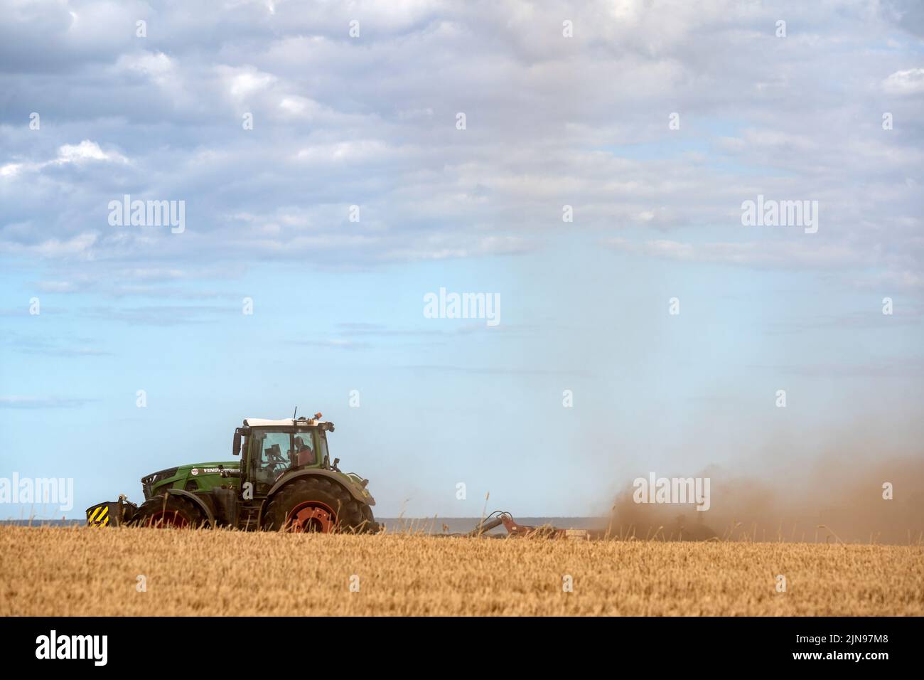 Stubble field undergoing cultivation Stock Photo