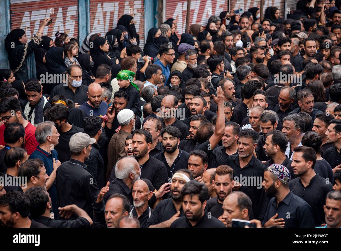 Shia Muslim mourners beat chests as they walk during Ashura procession ...