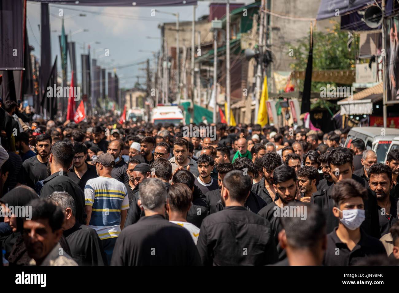 Shia Muslim mourners walk during Ashura procession. Ashura is the tenth ...