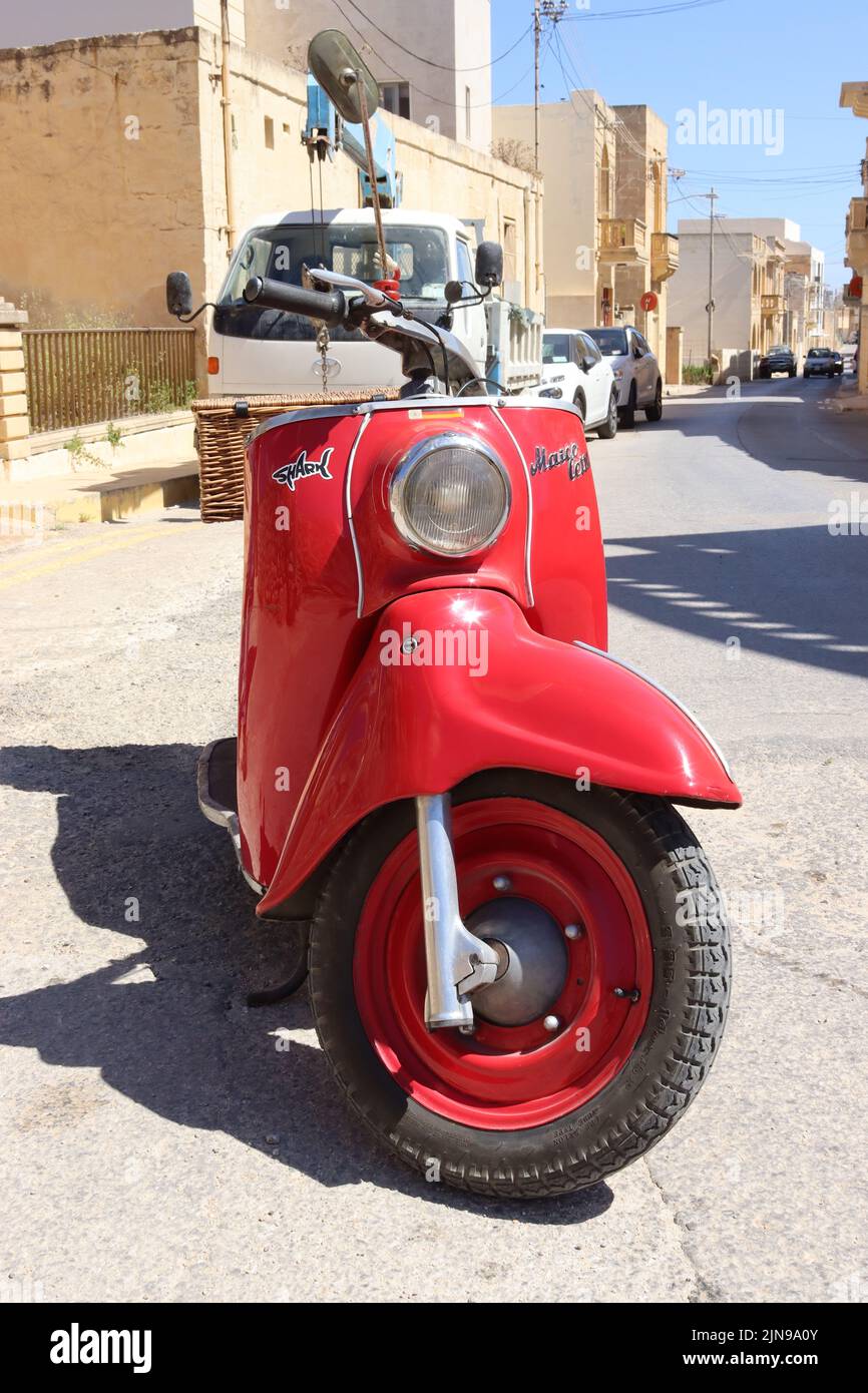 A  Maicoletta 250cc classic scooter purchased from Australia, now rides the roads of Gozo with its new owner. Stock Photo