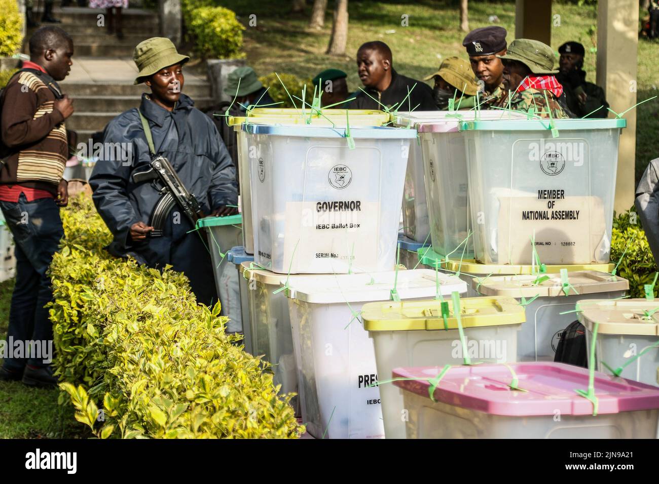 A police officer stands beside sealed ballot boxes at The Kenya Industrial Training Institute Tallying Center during Kenya's General Election. Results from all polling stations are expected to be completed today. (Photo by James Wakibia / SOPA Images/Sipa USA) Stock Photo