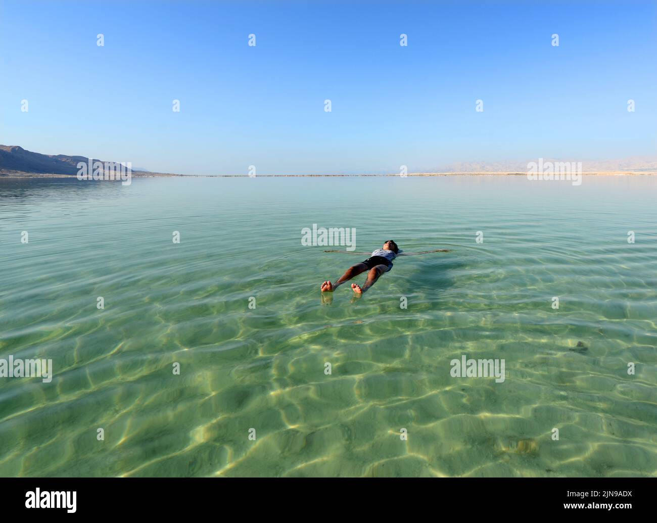 Floating on the salty water of the Dead Sea in Israel Stock Photo Alamy