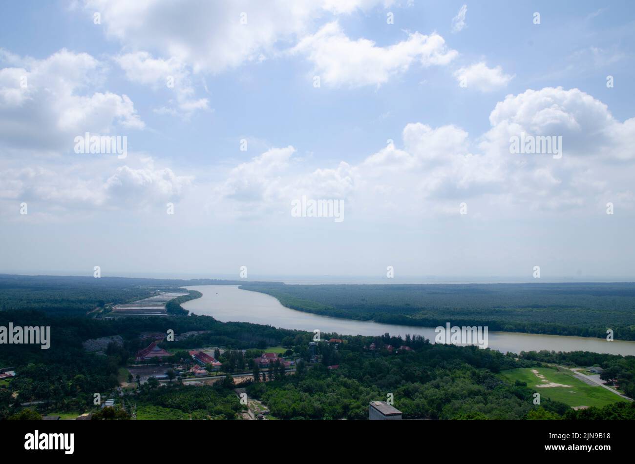 An aerial landscape of a small town in the forest at the river Stock ...