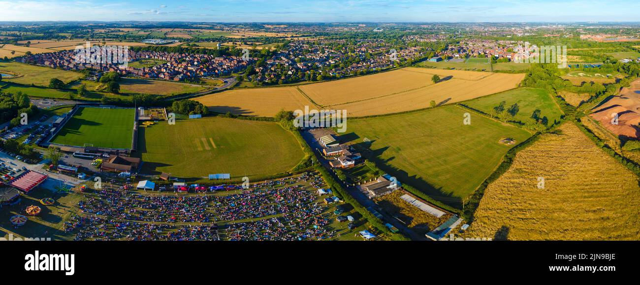 An aerial panoramic view of crowded Mickleover during music festival in England Stock Photo