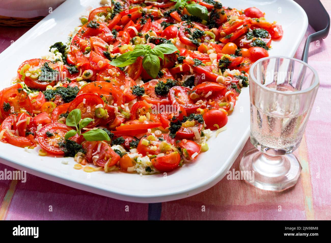 Caprese salad served on white plate Stock Photo
