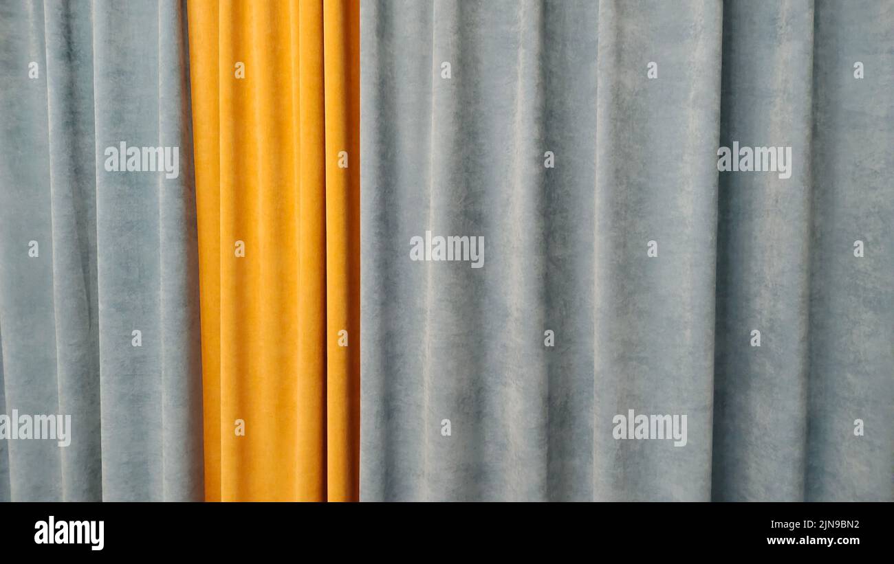 A background of yellow and silver pleat curtain Stock Photo
