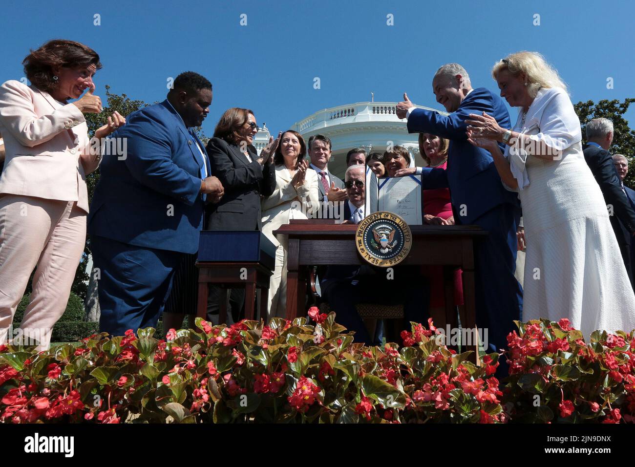 United States President Joe Biden shows his signature after signing