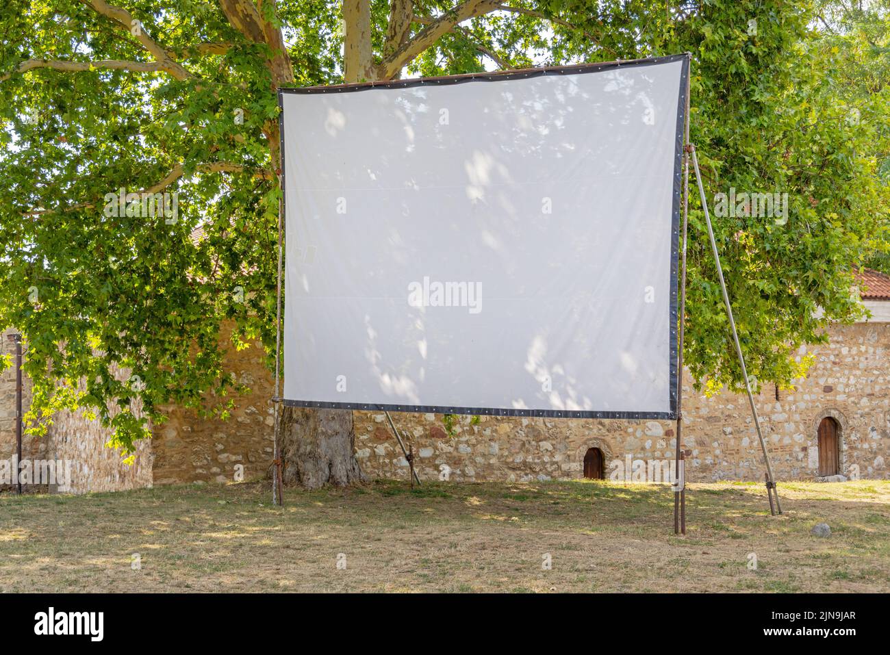 Projector Canvas Screen in Shade Woods Summer Day Copy Space Stock Photo