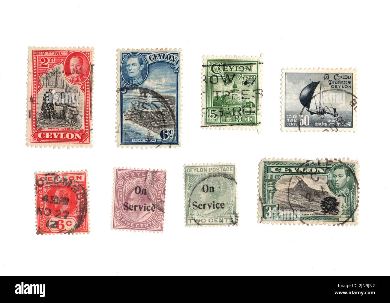 A selection of old postage stamps from Ceylon on a white background ...