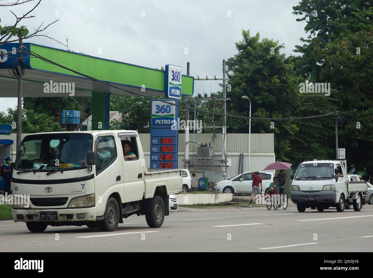 Yangon, Myanmar. 10th Aug, 2022. Motor vehicles drive by a petrol