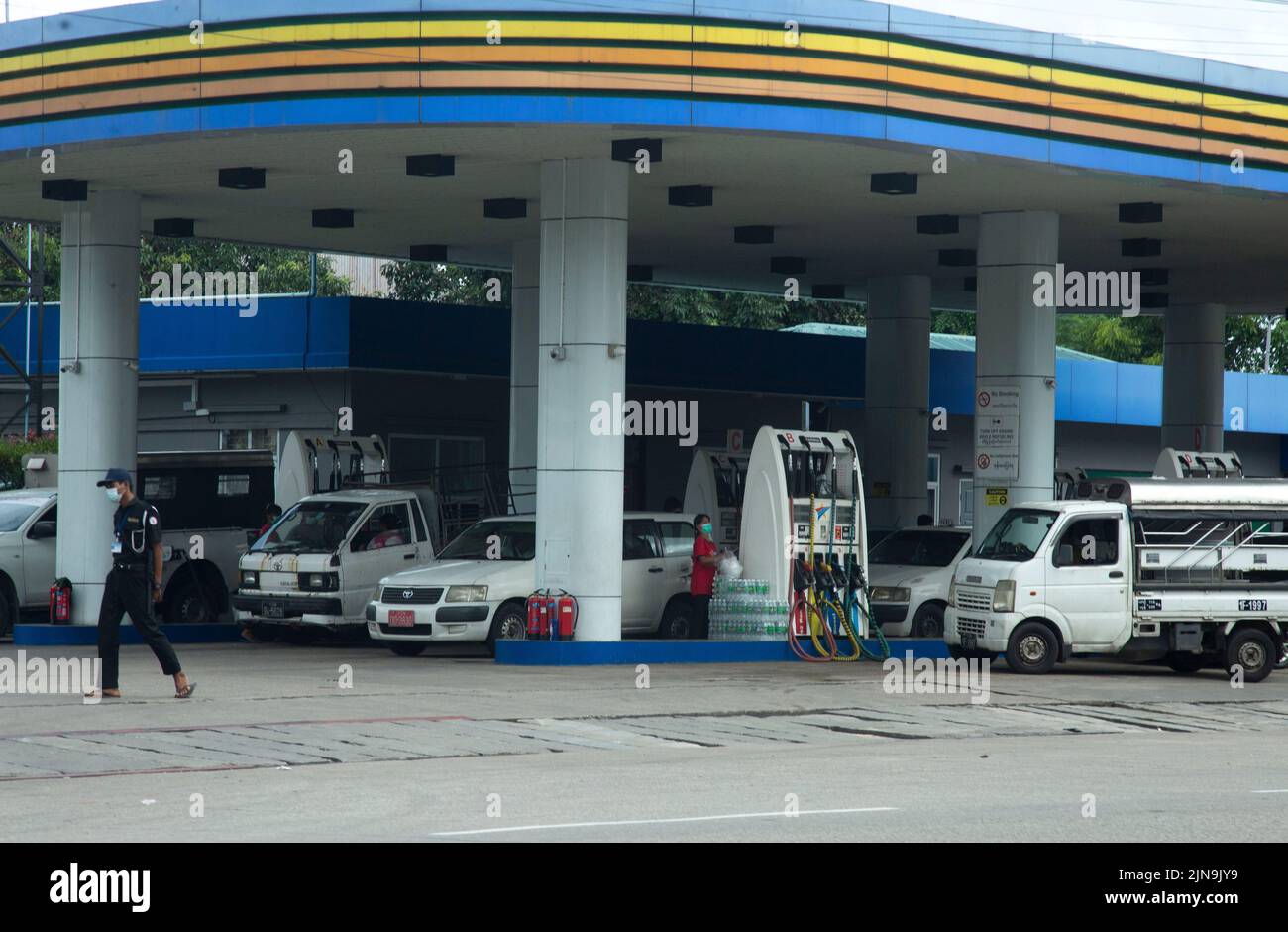 Yangon, Myanmar. 10th Aug, 2022. Motor vehicles line up for refuelling at a petrol station in Yangon, Myanmar, Aug. 10, 2022. Myanmar's petrol and diesel prices have risen some 3 percent from the prices a week earlier, before the central bank of Myanmar changed its reference exchange rates, official data showed Tuesday.TO GO WITH 'Petrol, diesel prices up around 3 pct in Myanmar' Credit: Myo Kyaw Soe/Xinhua/Alamy Live News Stock Photo