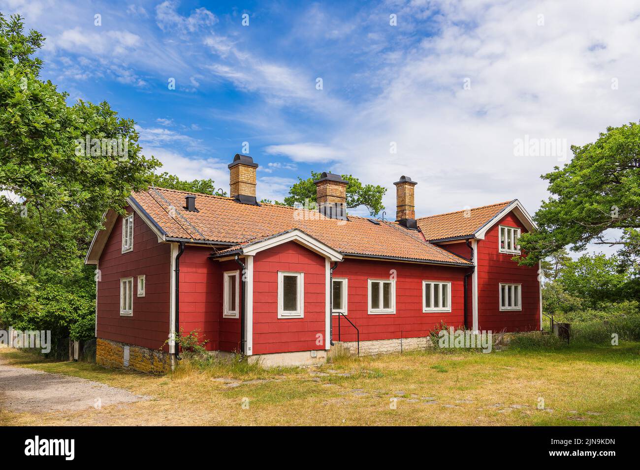 Red wooden house on the island Öland in Sweden. Stock Photo