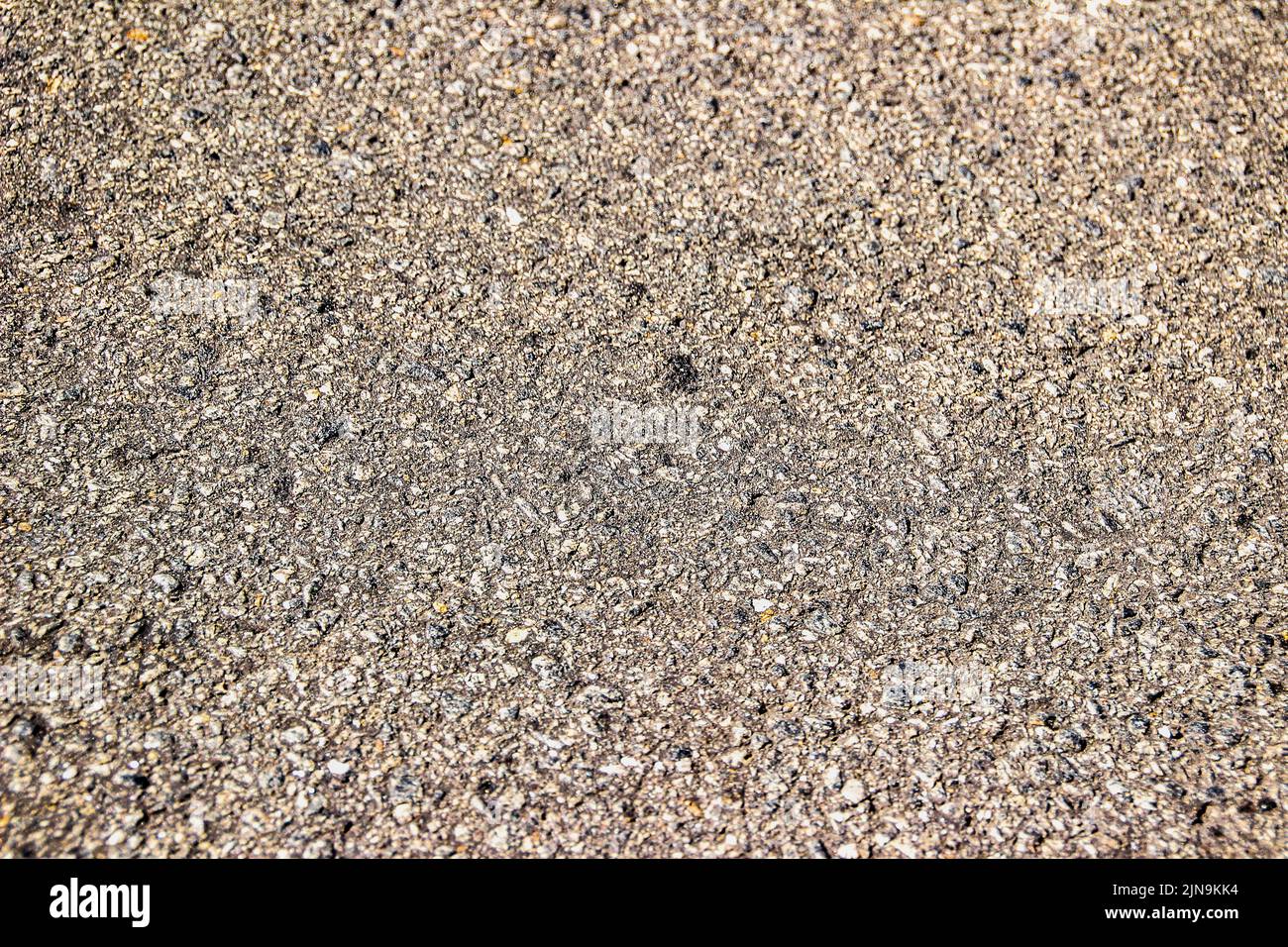 asphalt with stones Stock Photo Alamy