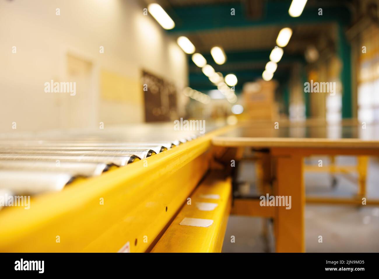 Fully automated logistics warehouse with a conveyor belt. Background is