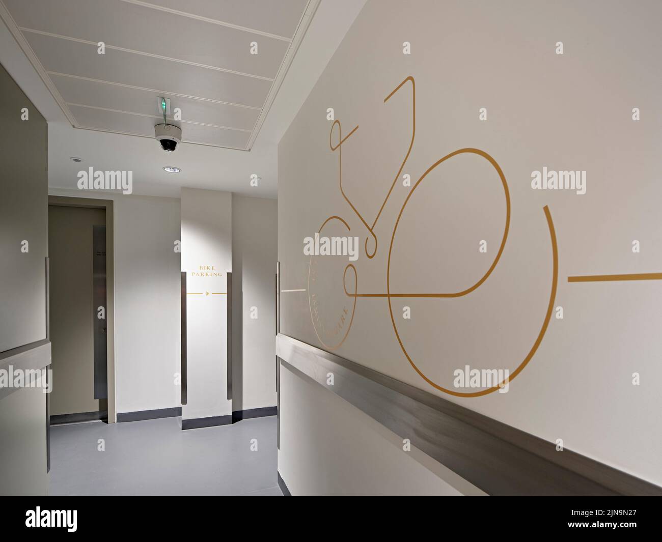 Corridor with wall graphics. 30 St James' Square, London, United Kingdom. Architect: Eric Parry Architects Ltd, 2021. Stock Photo