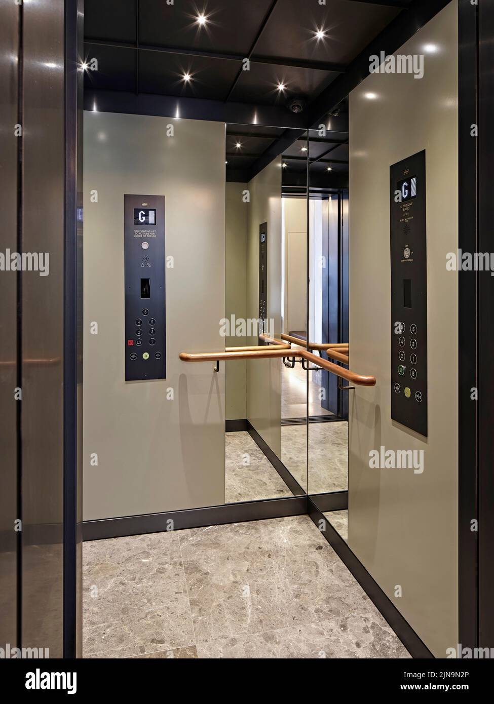 Elevator interior with mirrors. 30 St James' Square, London, United Kingdom. Architect: Eric Parry Architects Ltd, 2021. Stock Photo