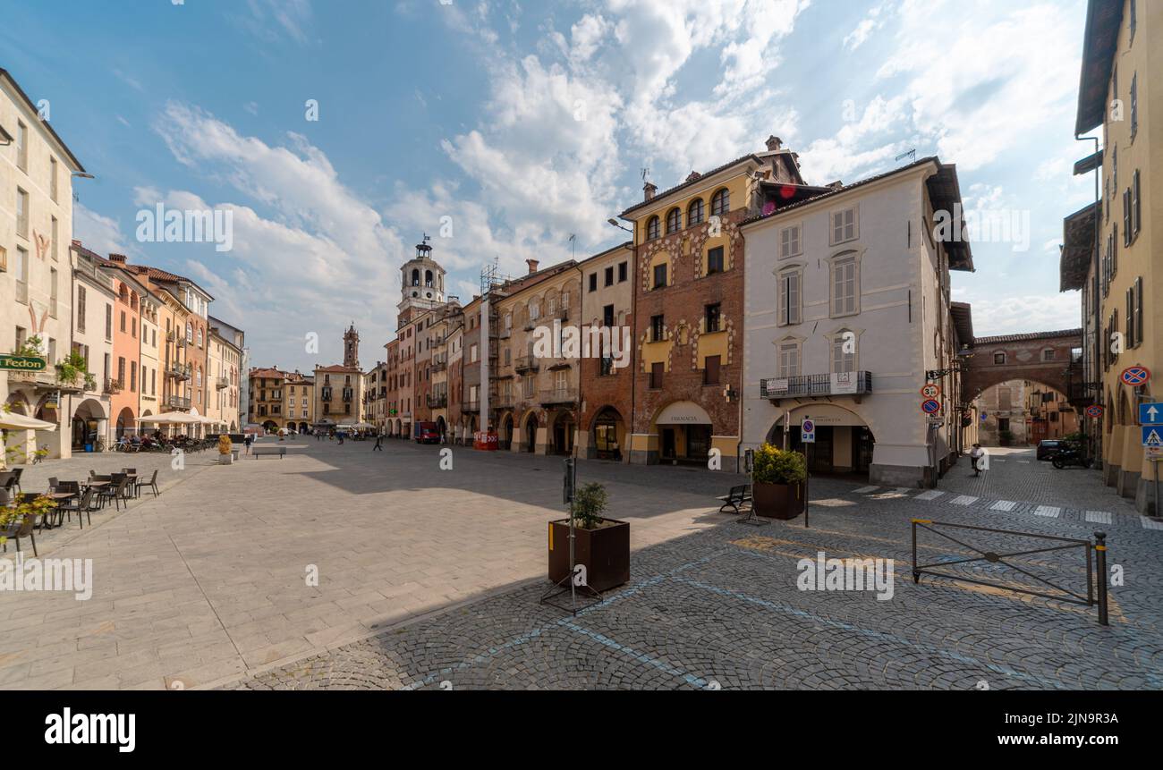 Savigliano, Piedmont Italy - August 10, 2022: Santarosa or Santa Rosa Square, with the civic tower and ancient buildings of medieval origin Stock Photo