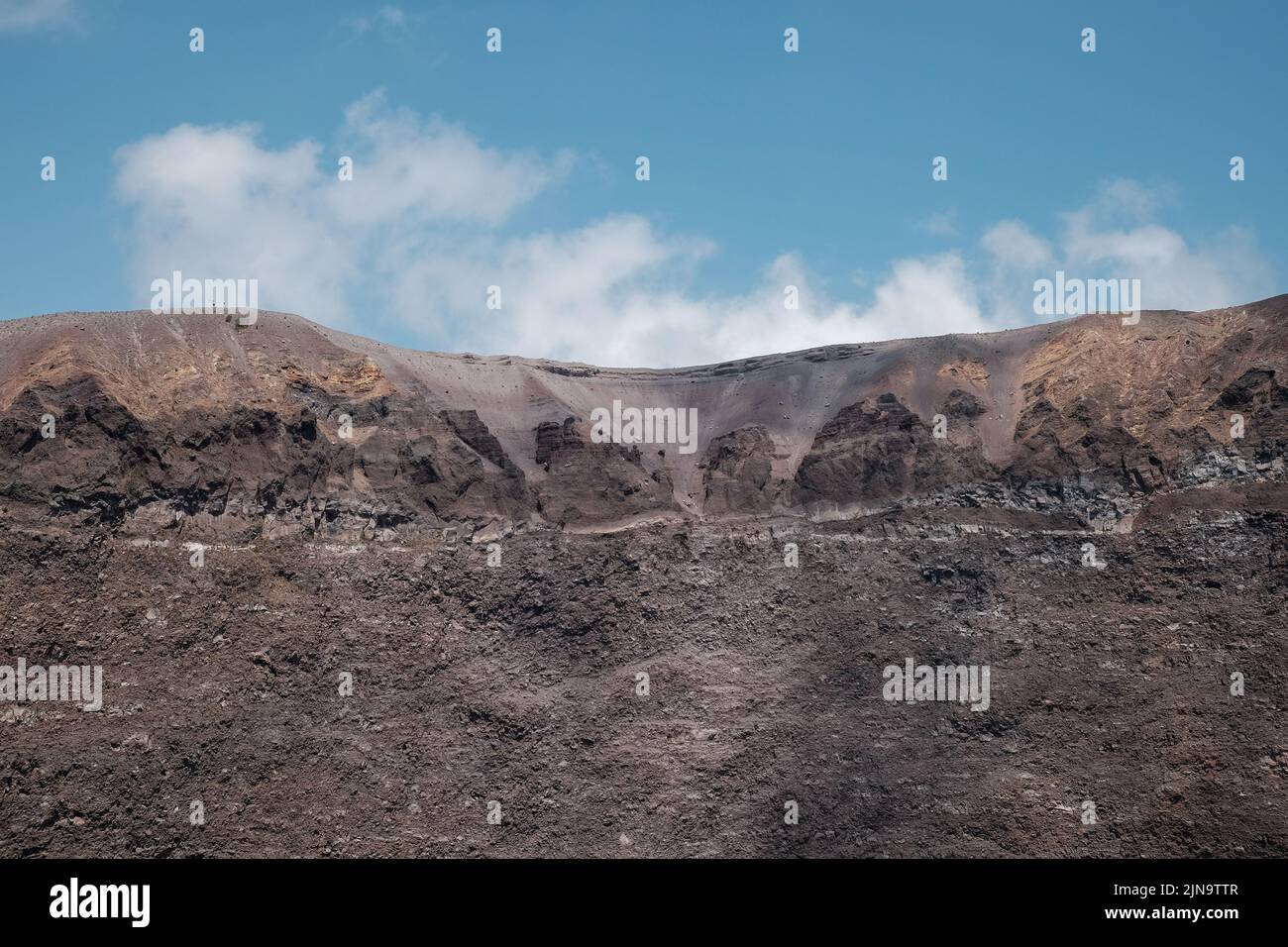 Close-ups around the cone at the top of Mount Vesuvius Italy showing the different layers of rock looking towards the closed vent. Stock Photo