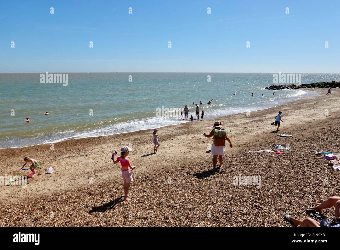 Felixstowe, Suffolk, UK 10 August 2022 People on the beach and in