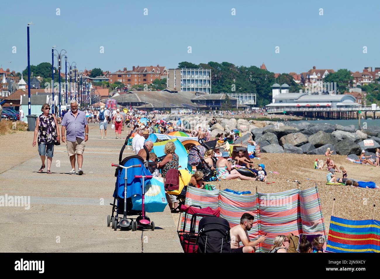 Felixstowe, Suffolk, UK - 10 August 2022 : People on the sea front enjoying the hot weather. Stock Photo