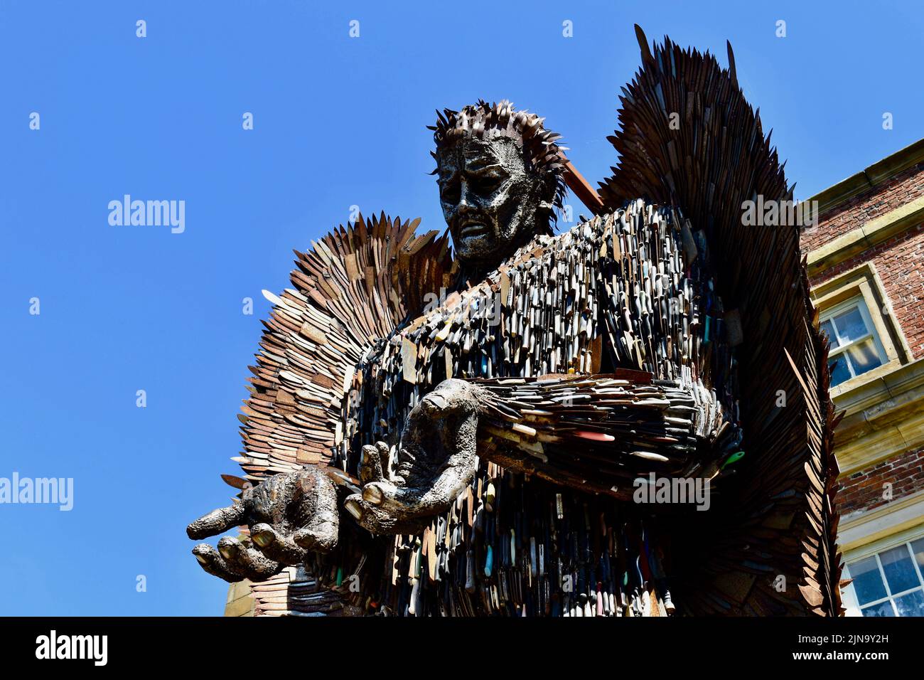 Redcar, UK. 10 Aug 2022. The thought provoking ‘Knife Angel’, comprised of 100,000 weapons removed from the streets of Britain, sculpted by Alfie Bradley is on display at Kirkleatham Museum, Redcar during August. The Angel was designed with the support of all 43 UK Police Forces to create social change through raising awareness of how violence & aggressive behaviour impacts our communities through education and working with young people to renounce violence as a way of solving problems.  It also acts as a memorial for those lives lost. Credit:  Teesside Snapper/Alamy Live News Stock Photo