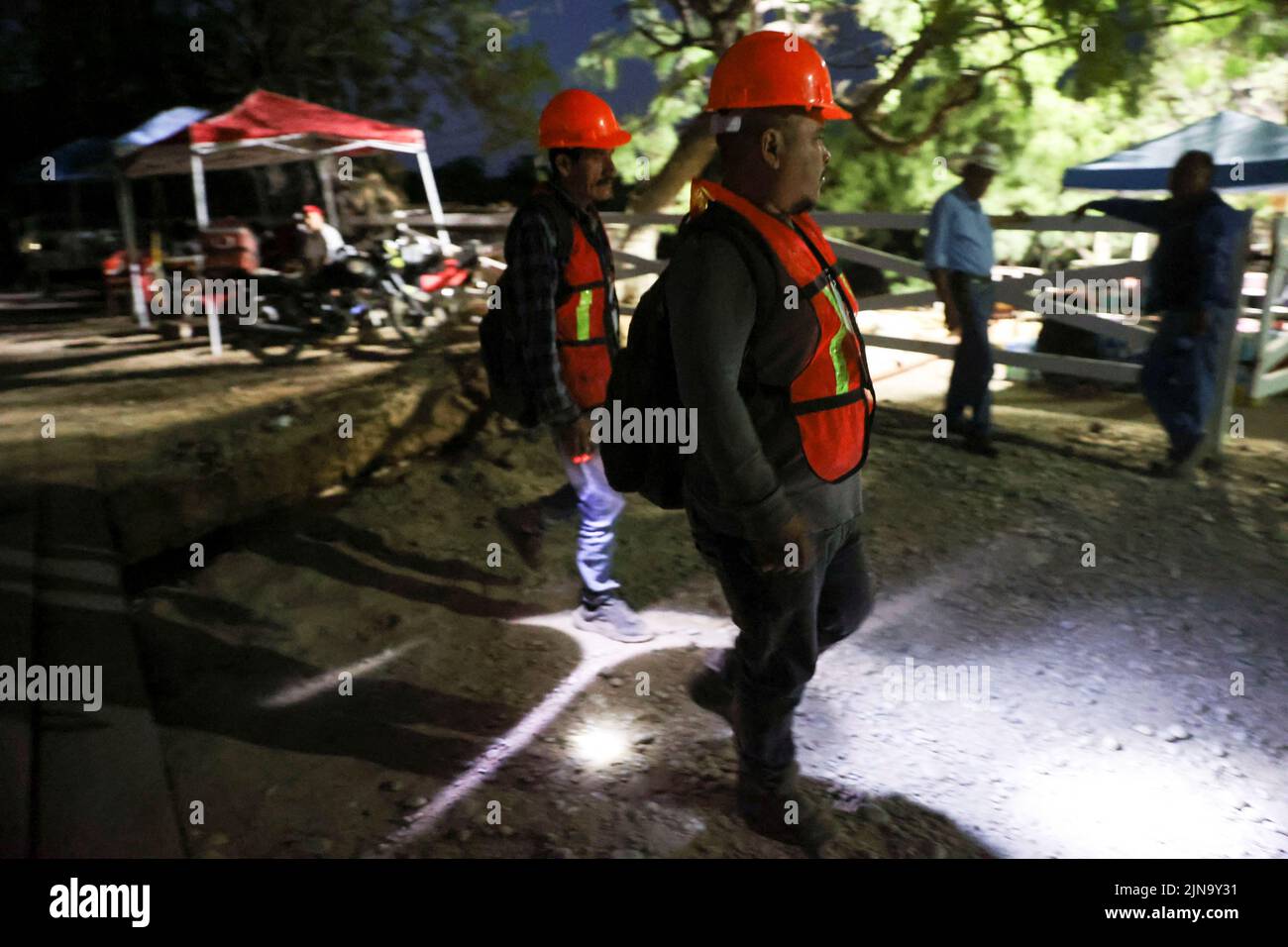 Workers participate in the rescue operation for miners trapped in a coal mine that collapsed in Sabinas, in Coahuila state, Mexico, August 10, 2022. REUTERS/Luis Cortes Stock Photo