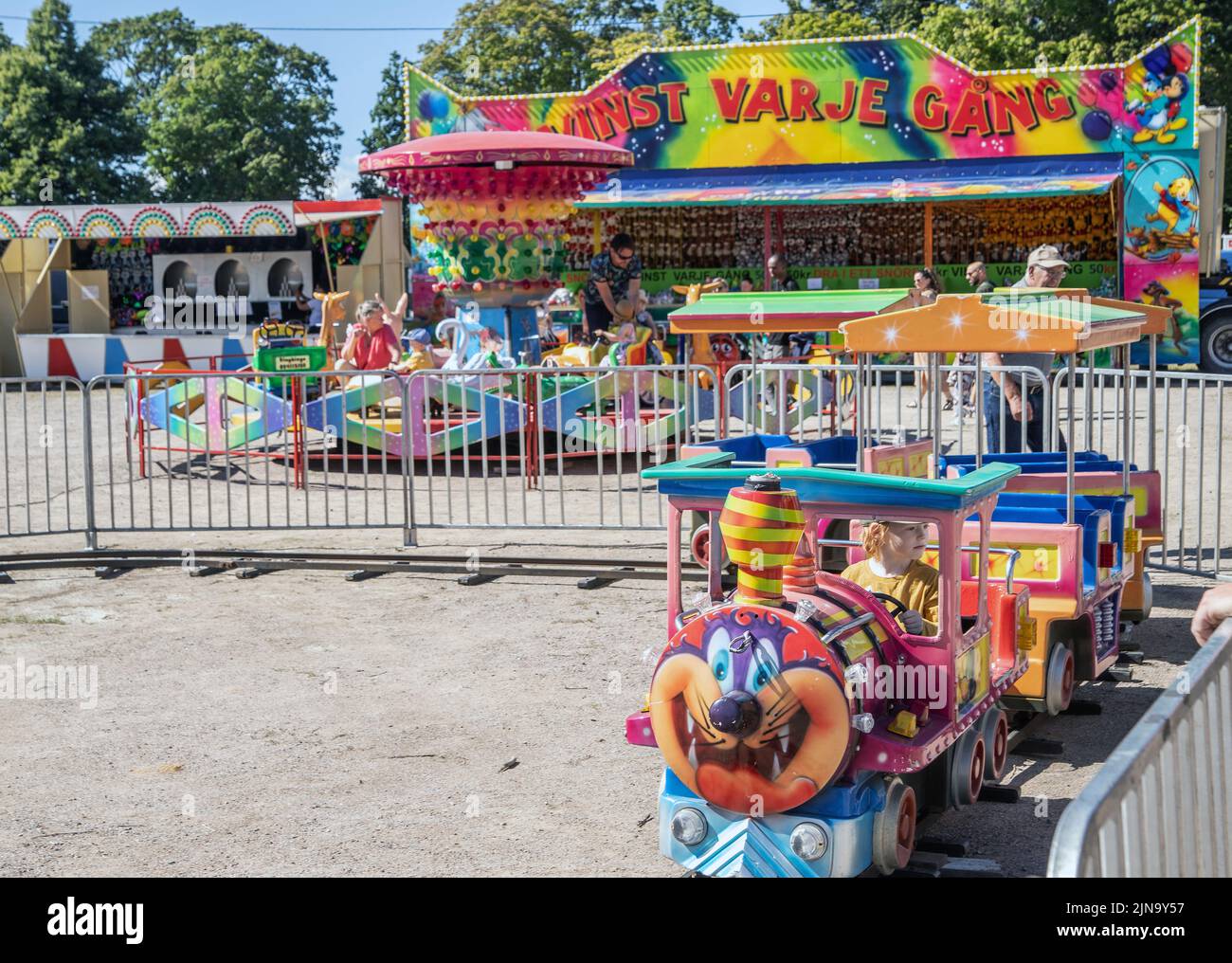People enjoy mobile Tivoli.  Amusement park, during the market fest.  an annual event in Malmkoping, Sweden Stock Photo