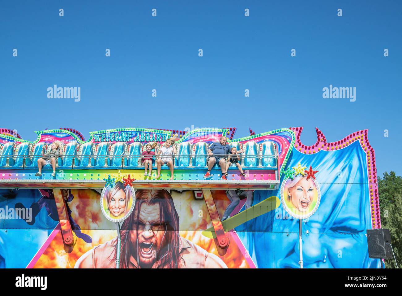 People enjoy mobile Tivoli.  Amusement park, during the market fest.  an annual event in Malmkoping, Sweden Stock Photo