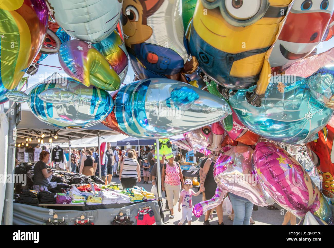 helium filled ballons of differnt designs for sale at a market in Malmkoping, sweden Stock Photo