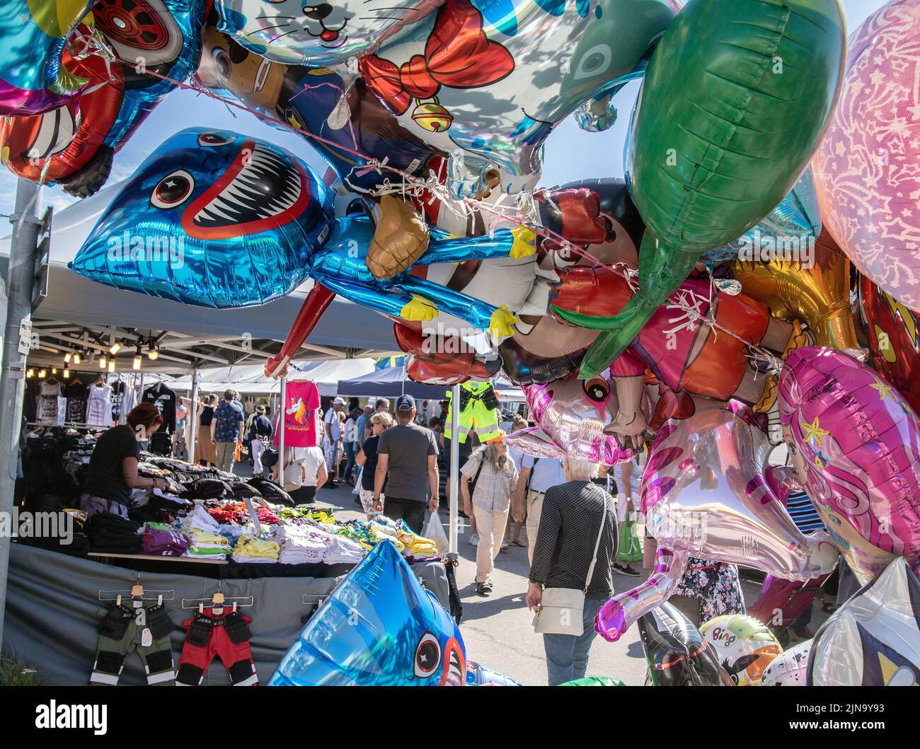 helium filled ballons of differnt designs for sale at a market in Malmkoping, sweden Stock Photo