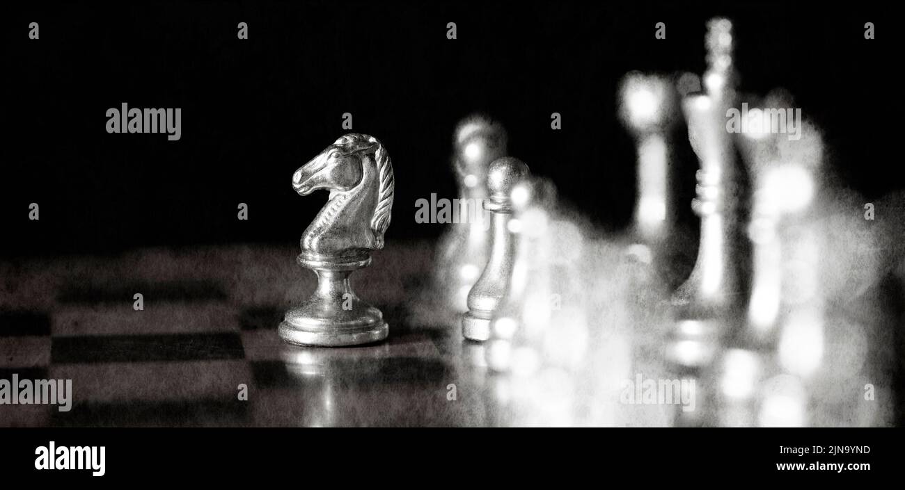 Pieces on chess board for playing game and strategy knight kingdom gaming Stock Photo