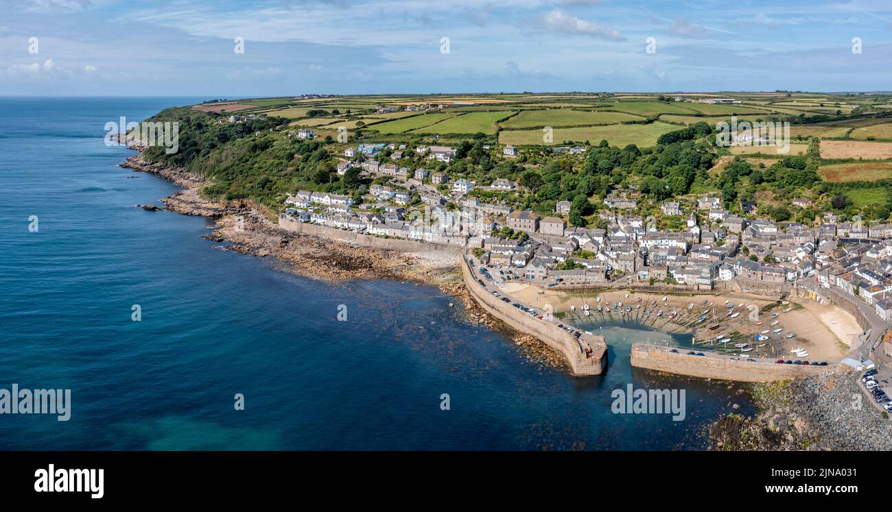 mousehole village and harbour cornwall at low tide sunny day elevated view panorama Stock Photo