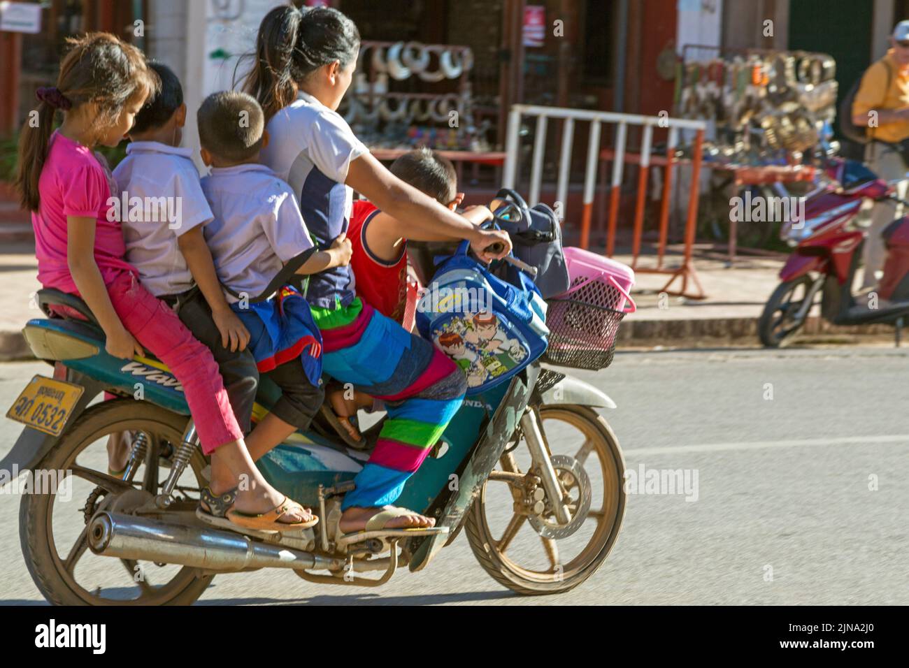 Family on a motorcycle, Luang Prabang, Laos Stock Photo