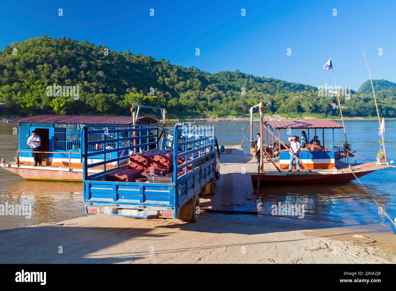Ferry boat on Mekong river, Luang Prebang, Laos Stock Photo