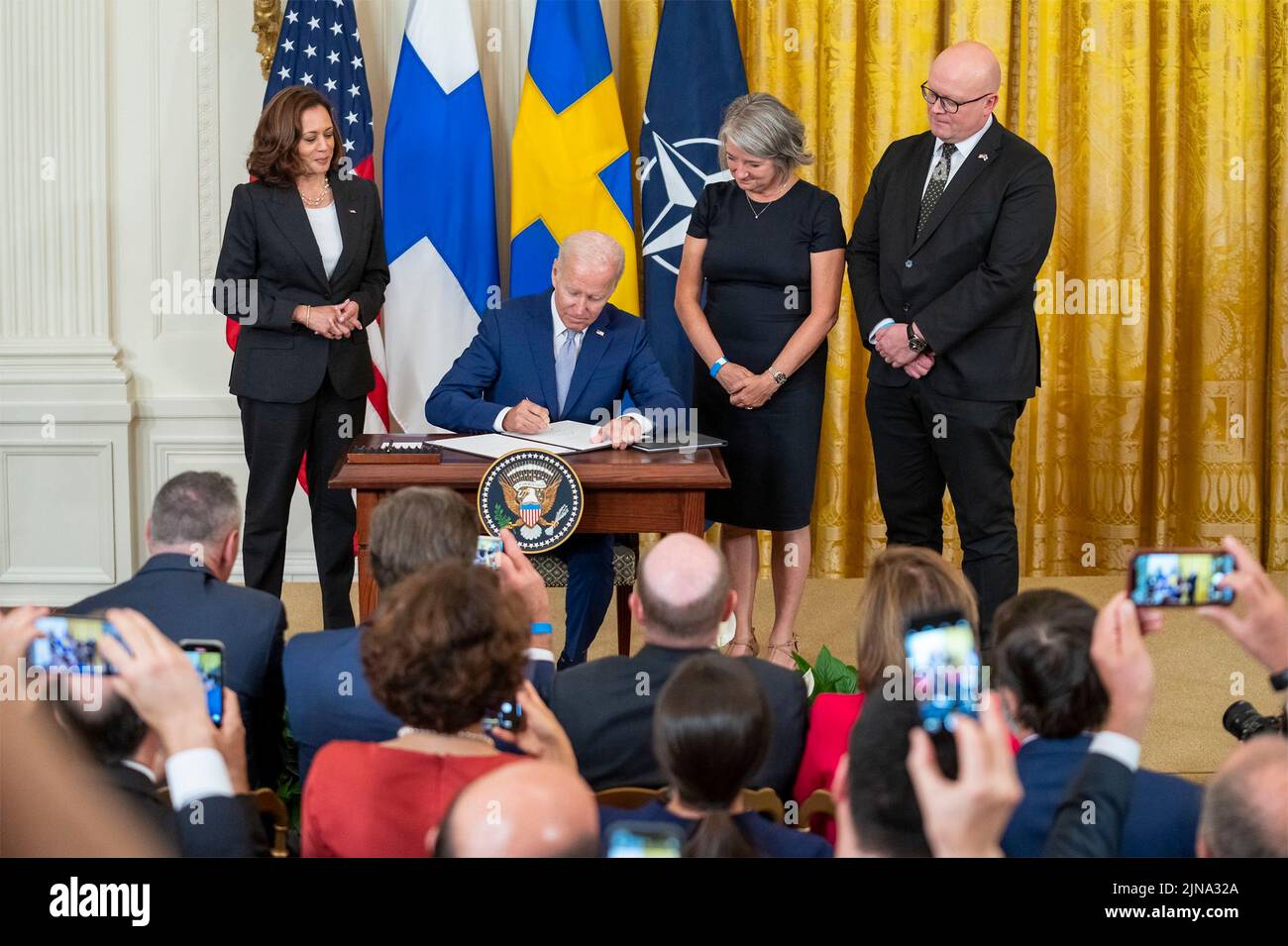 Washington, United States Of America. 09th Aug, 2022. Washington, United States of America. 09 August, 2022. U.S President Joe Biden, signs the Accession Protocols approving Sweden and Finland as the newest members of the North Atlantic Treaty Organization during a ceremony in the East Room of the White House August 9, 2022 in Washington, DC Standing left to right are: Vice President Kamala Harris, President Joe Biden, Swedish Amb. Karin Olofsdotter, and Finnish Amb. Mikko Hautala. Credit: Adam Schultz/White House Photo/Alamy Live News Stock Photo